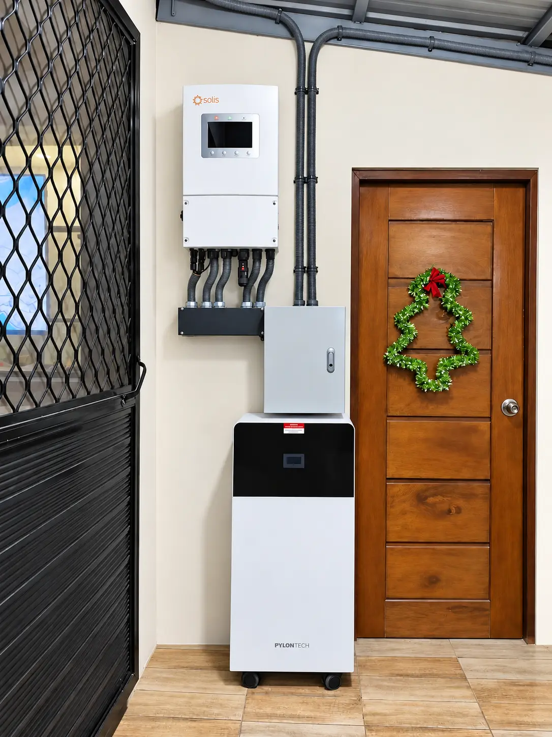 Solis inverter and battery setup near a residential doorway in Lucena City, Quezon